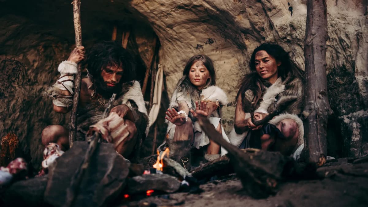 Archaeological illustration of Neanderthal family group living together in ancient cave environment
