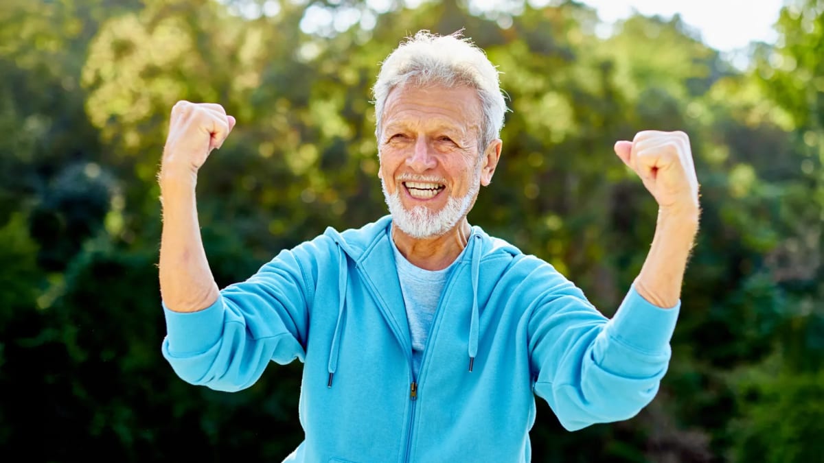 Diverse group of older adults participating in outdoor exercise class in Latin American park