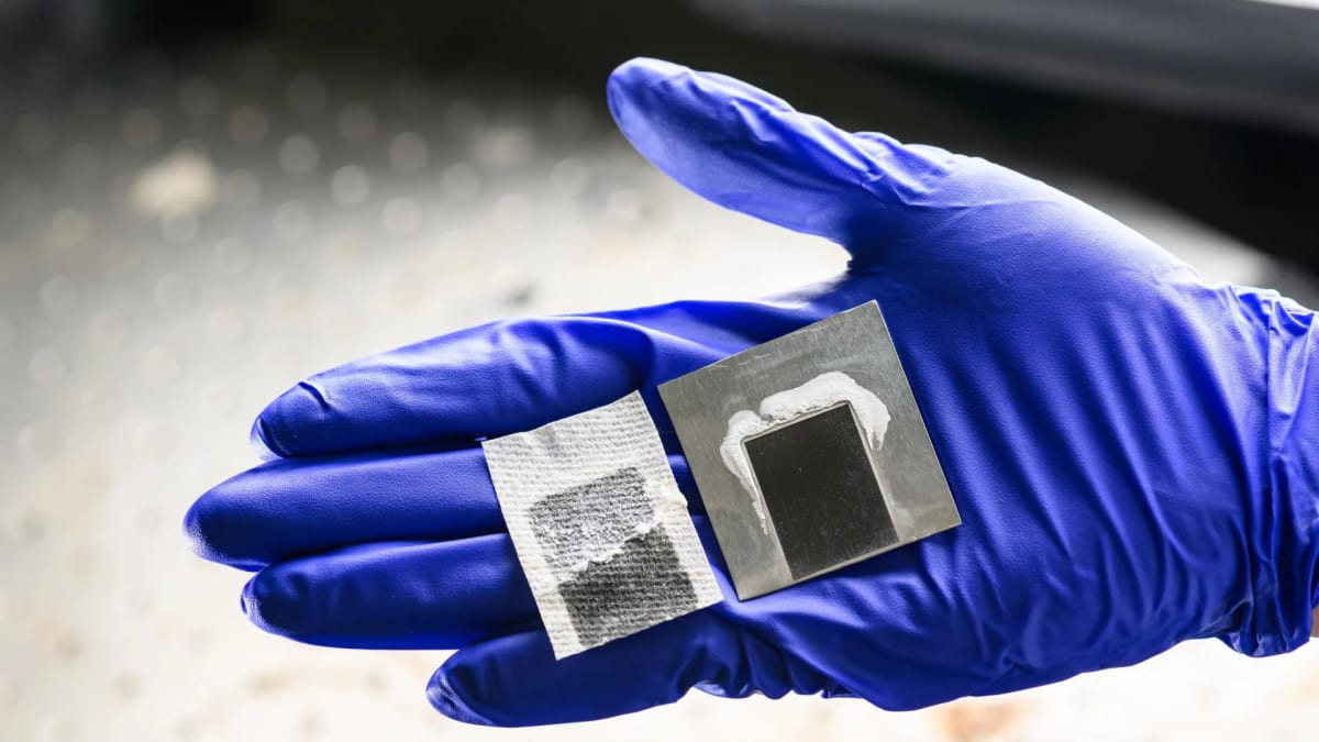 Laser-etched black metal solar panel producing fresh water from seawater in laboratory setting