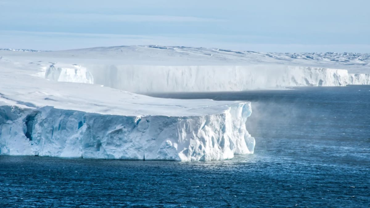 Vanderford Glacier in Antarctica showing massive ice sheets meeting the ocean under clear skies
