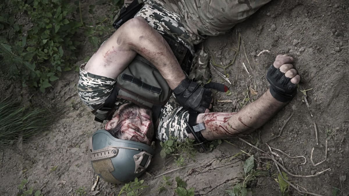 Medical professional spraying white powder onto wound demonstrating new emergency bleeding control technology