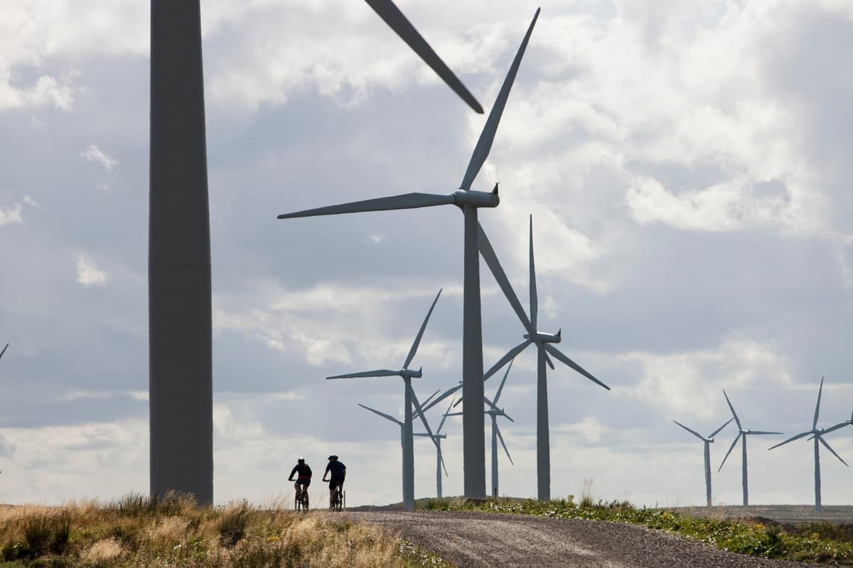 Wind turbine nacelle assembly showing large machinery components in modern manufacturing facility