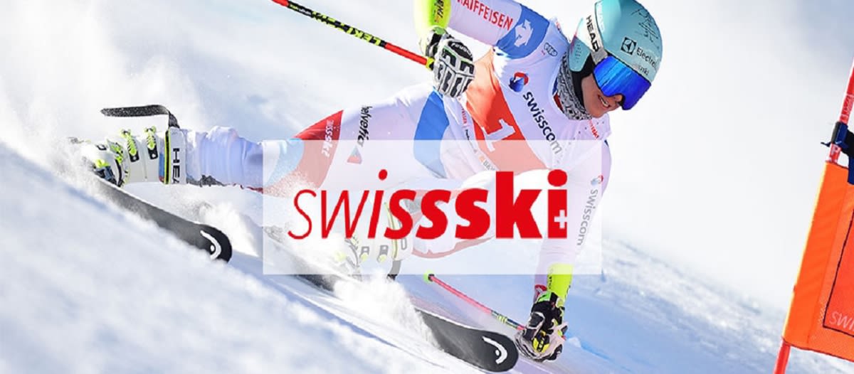 Swiss Olympic skiers celebrating with medals on podium at Winter Olympics ceremony