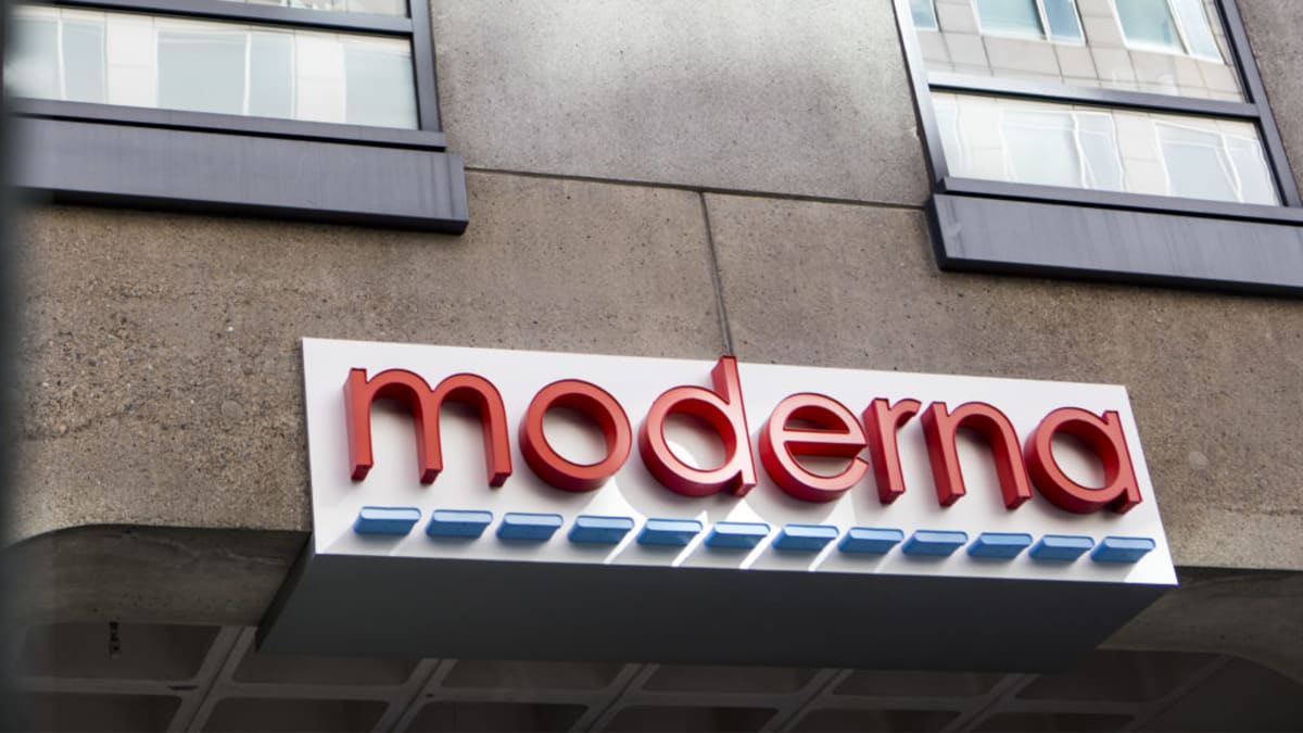 Modern biotech laboratory with researchers working on mRNA vaccine development and innovation