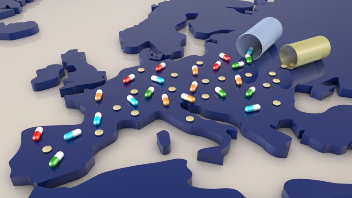 Medical professional organizing rows of medicine bottles and pharmaceutical supplies in modern European facility