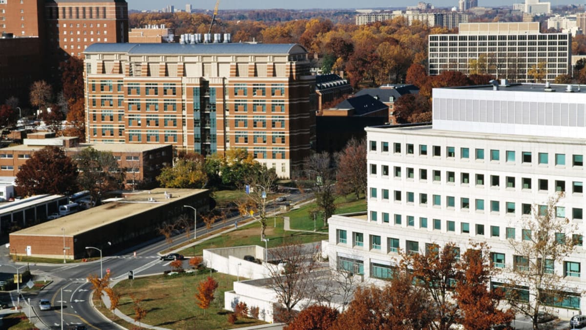 National Institutes of Health campus buildings in Bethesda, Maryland on a clear day