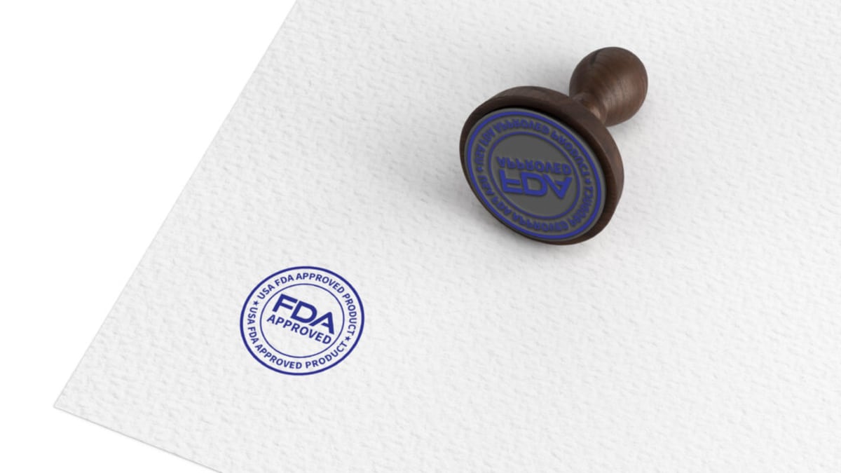 Medical researcher working with gene therapy vials in modern laboratory setting