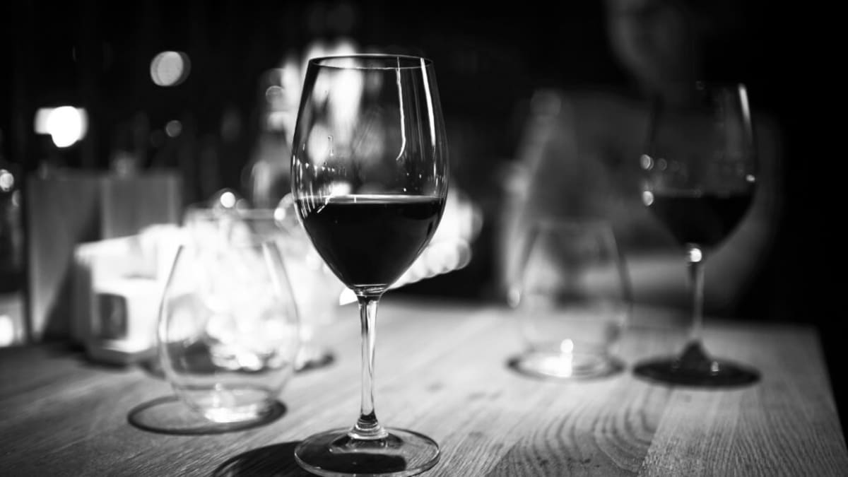 Medical researcher examining brain scan imagery showing regions affected by GLP-1 medications and addiction pathways