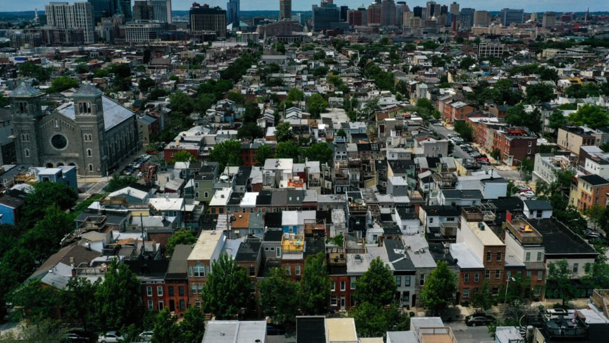 Aerial view of Baltimore cityscape showing urban neighborhoods and buildings on sunny day