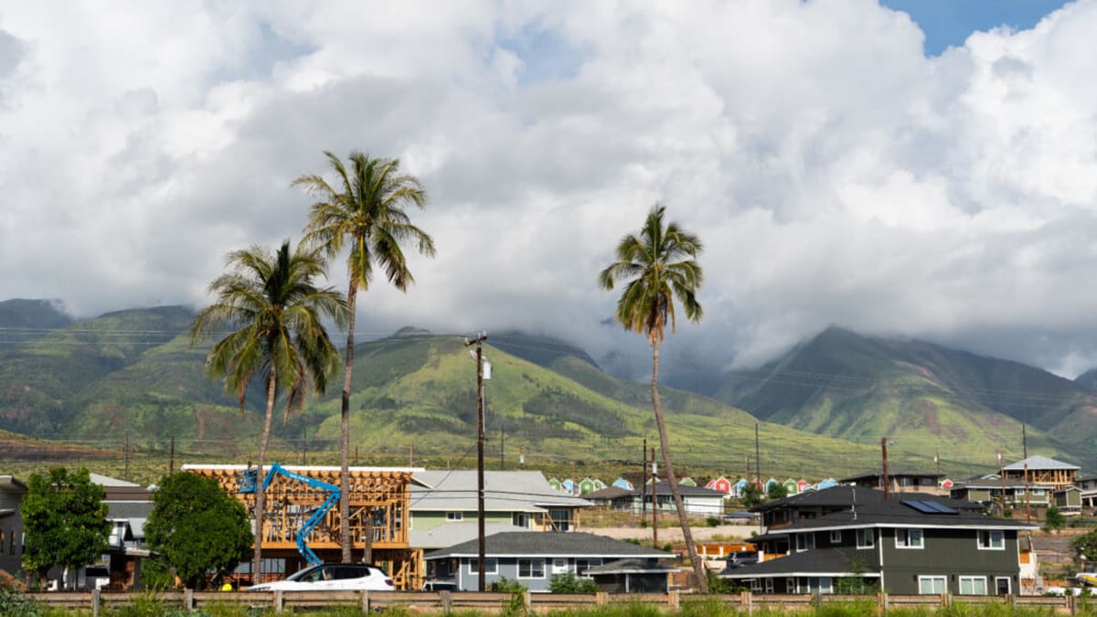 Medical researchers working with community members in a health center near Lahaina, Maui
