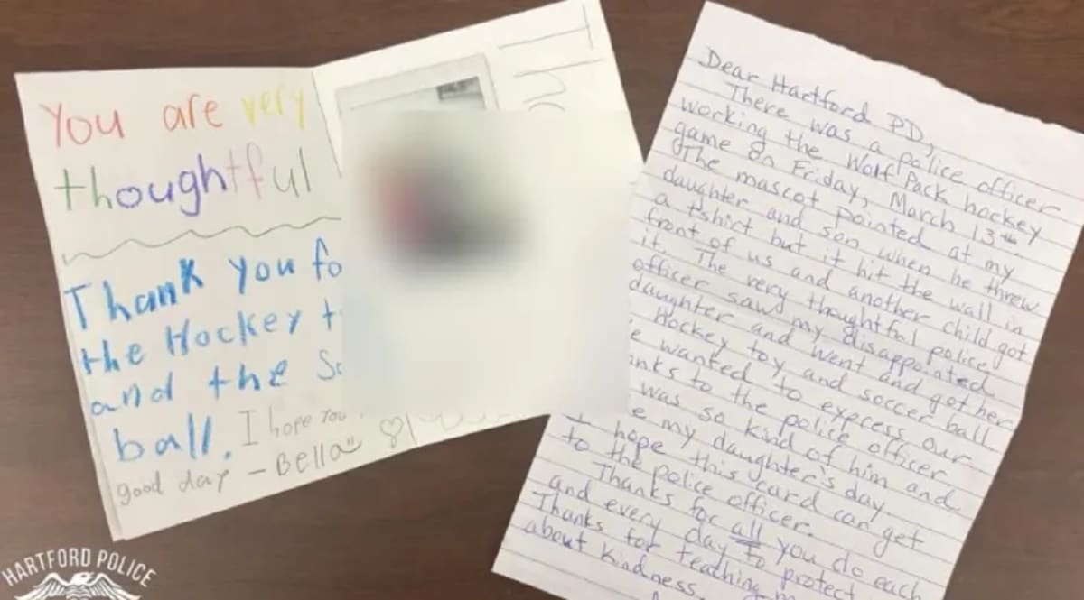 Officer Christopher Vanwey in uniform smiling at camera, Hartford Police Department