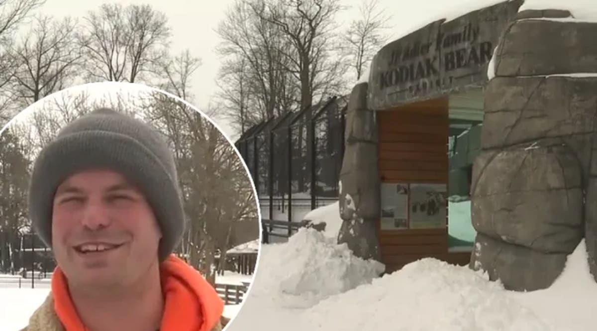 Zoo manager Kyle Kirk standing in deep snow at Wildwood Zoo during Wisconsin blizzard