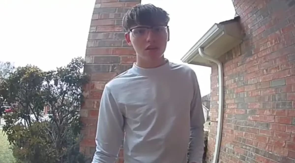 Young Meals on Wheels volunteer Alekzander Dzivak standing with elderly woman Ms. Lana after rescue