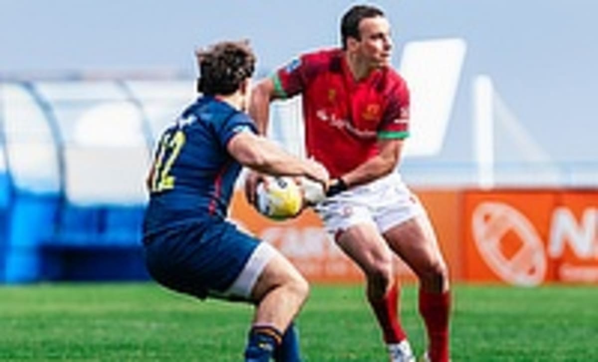 ** Young rugby player Manuel Vareiro in Portugal jersey celebrating championship victory on field