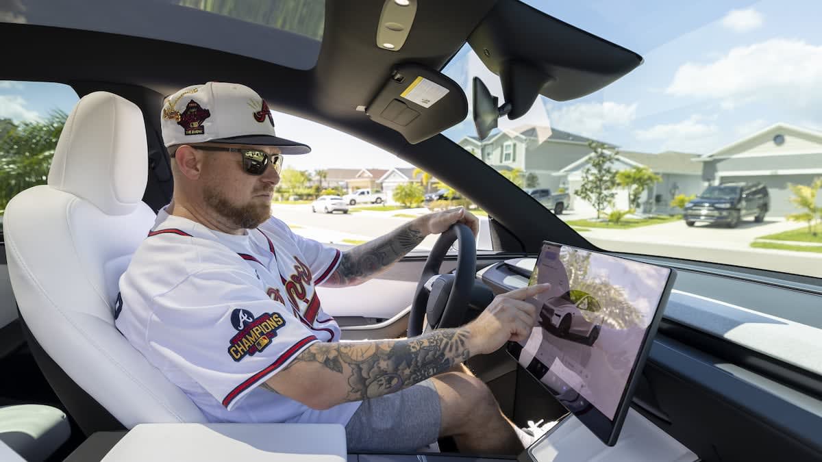 Tesla electric vehicle charging at home station in Tampa Bay area driveway