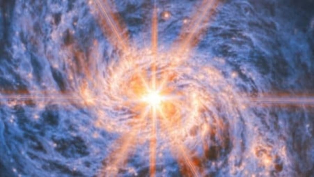 Webb Telescope Captures Glowing Heart of Distant Galaxy