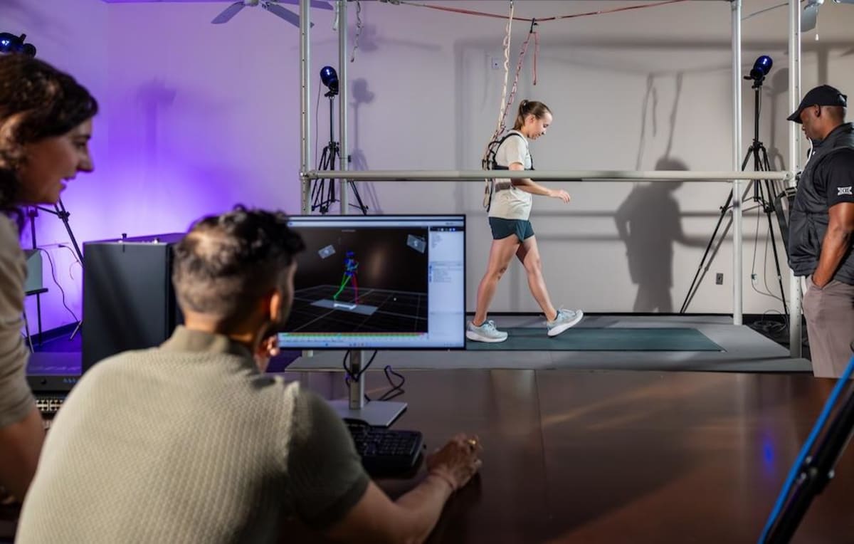 Texas Christian University campus building with students walking between modern academic facilities