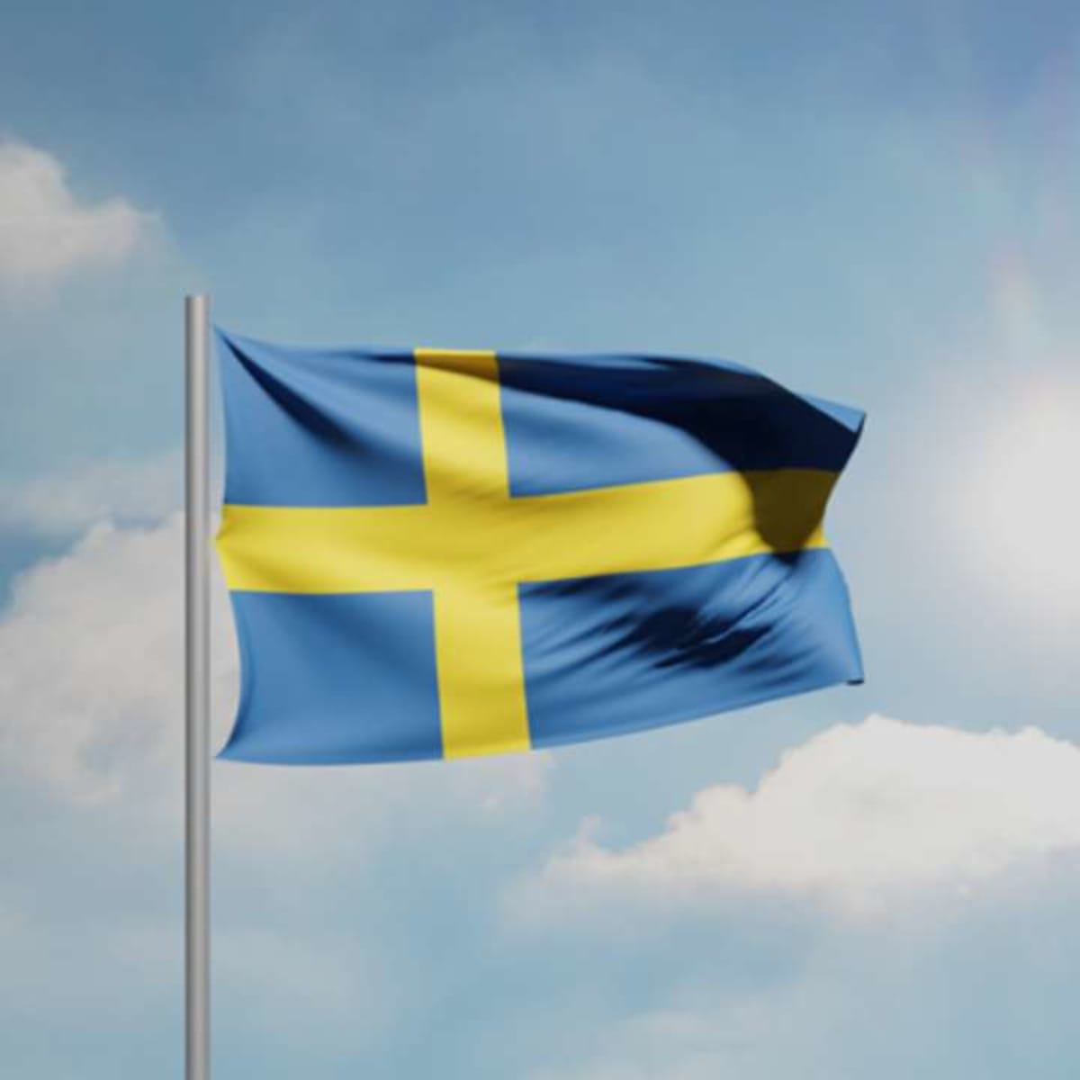 ** Offshore wind turbines spinning in blue ocean waters under clear Scandinavian sky
