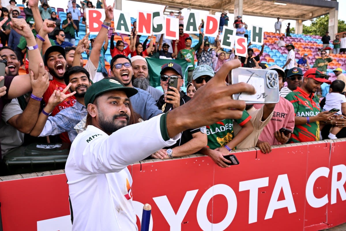 Bangladesh cricket players celebrating together on field after historic Test victory in Australia