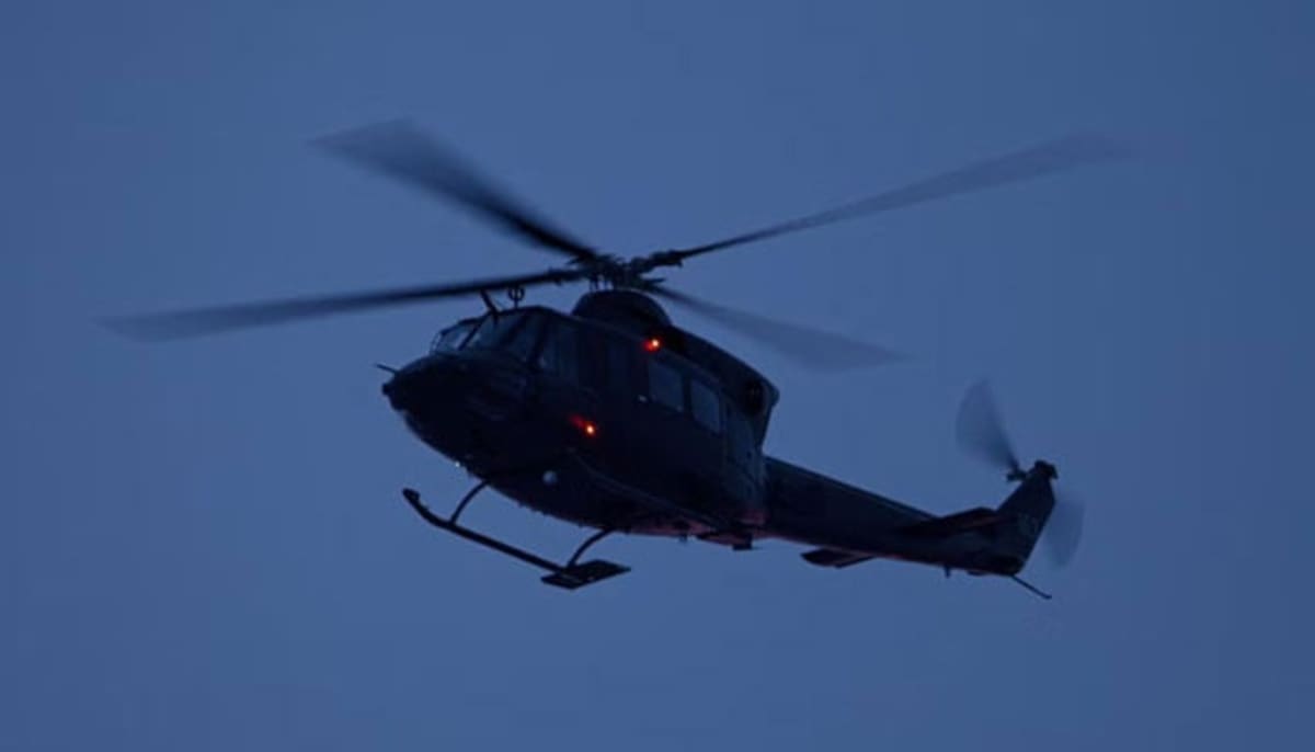 Helicopter Pilot Rescues Two Men and Dog From Flood