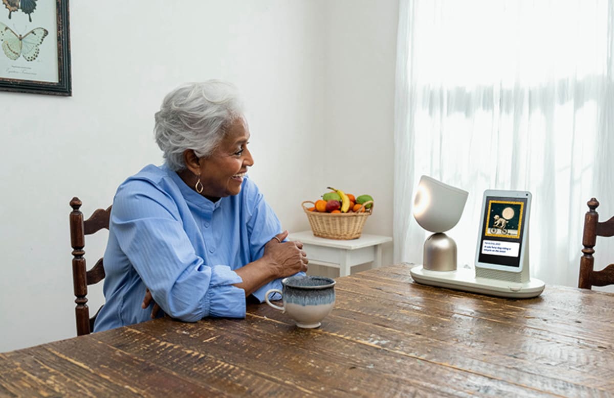 ElliQ AI companion device with screen and friendly design helping seniors age independently at home