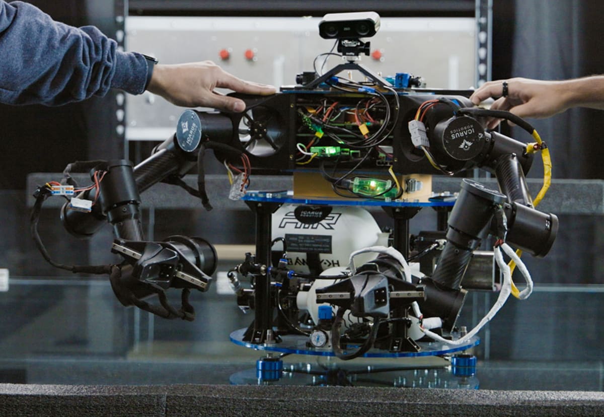 Joy robot with mechanical arms floating inside the International Space Station helping with tasks