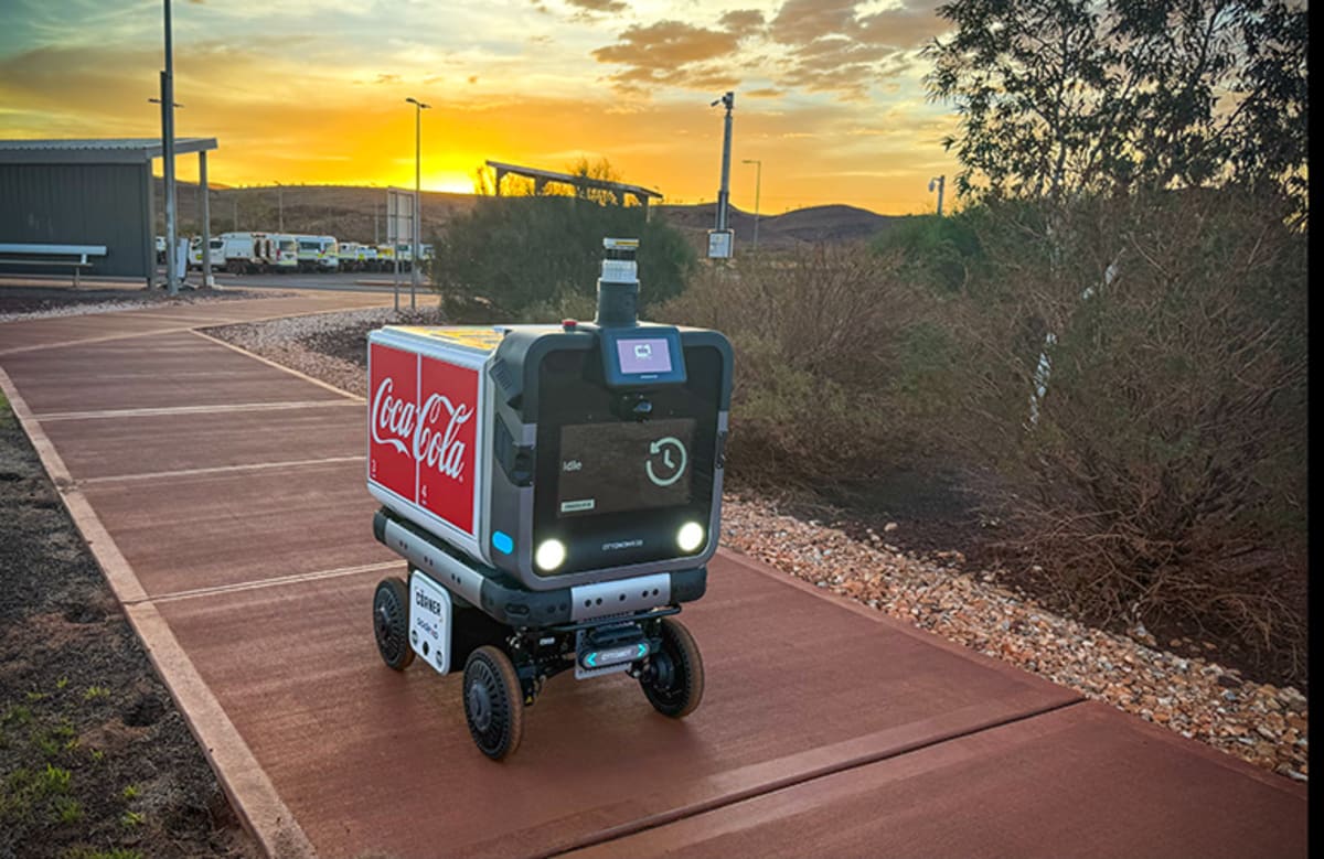 Ottobot delivery robot navigating outdoor path at remote Australian mining village