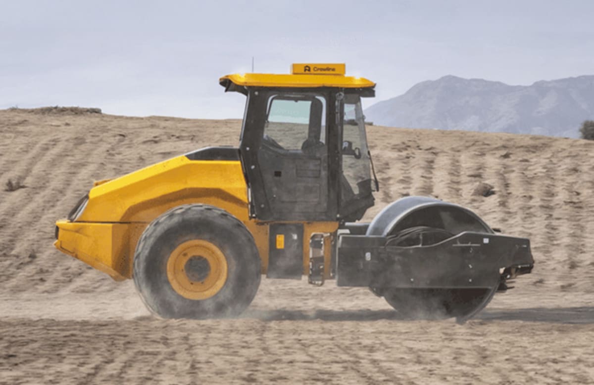 Autonomous soil compaction roller working on construction site with retrofit automation kit installed