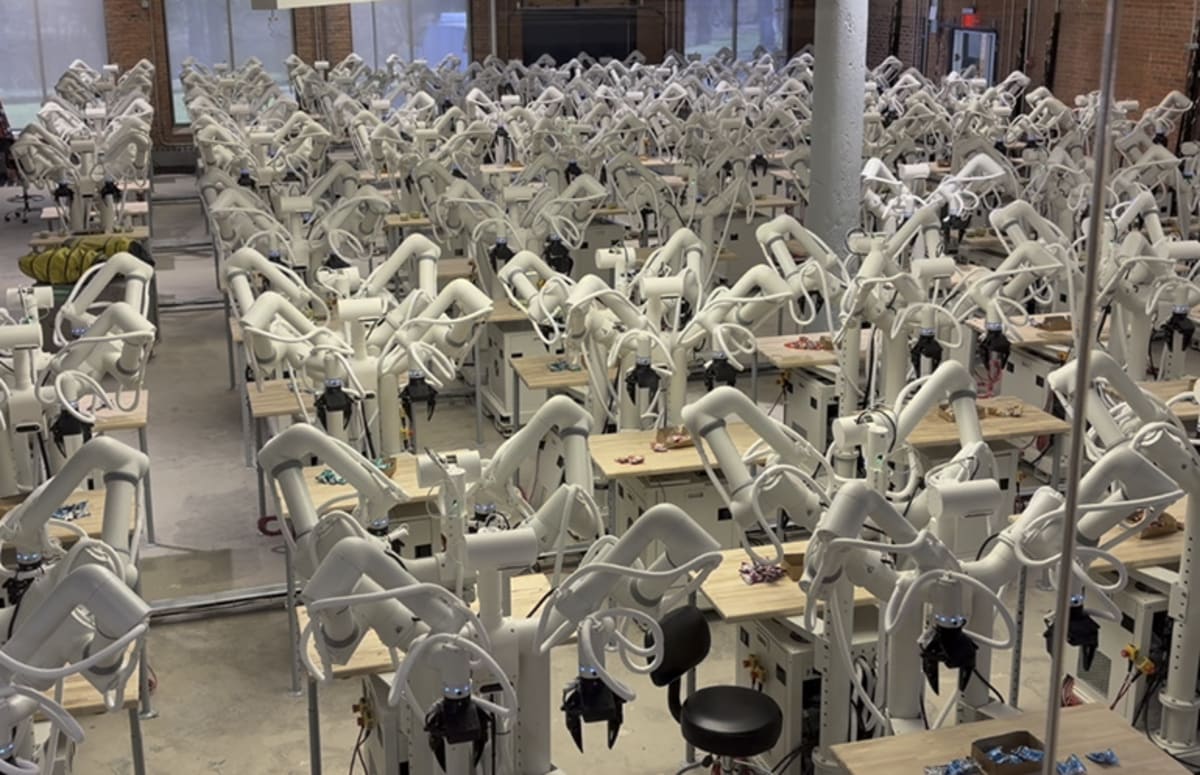 Two-armed humanoid robots learning package sorting tasks inside warehouse training facility