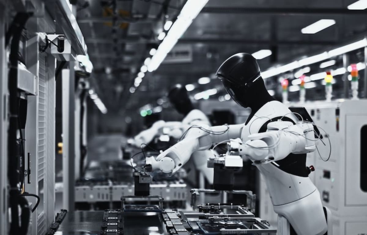 AGIBOT G2 humanoid torso robot with wheeled base working on factory production line