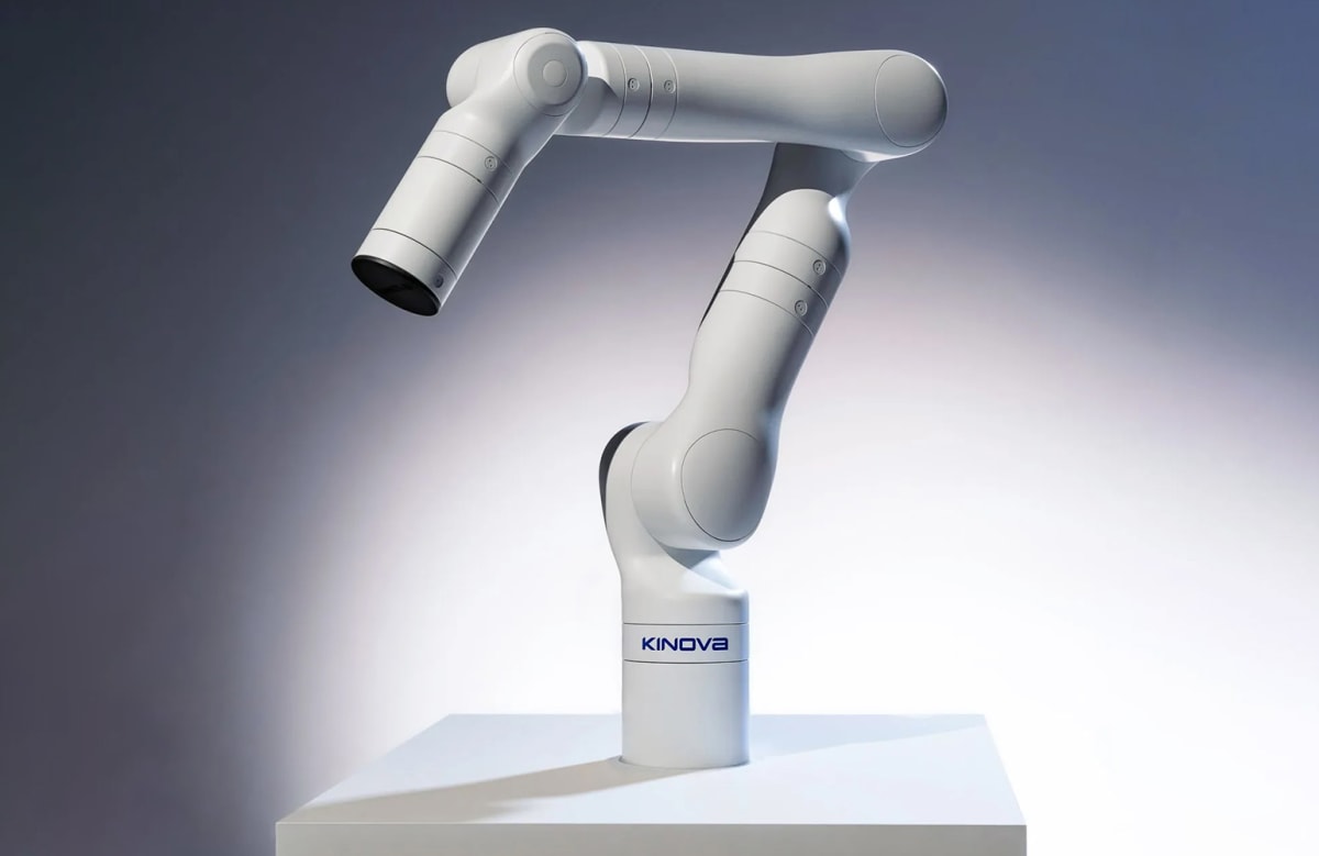 Compact white robotic surgical arm KIMA in modern clinical operating room setting