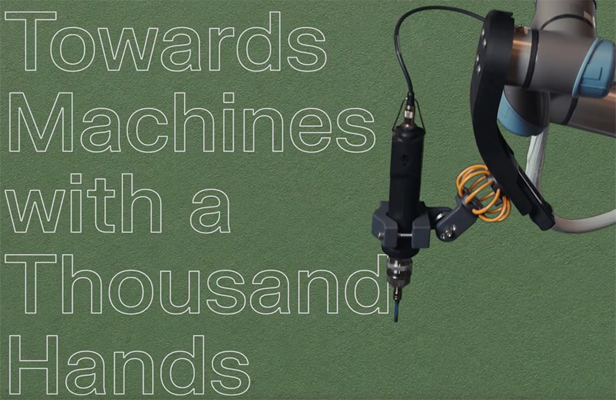 Robot arm with interchangeable hands using various tools including whisk, screwdriver, and tongs on table