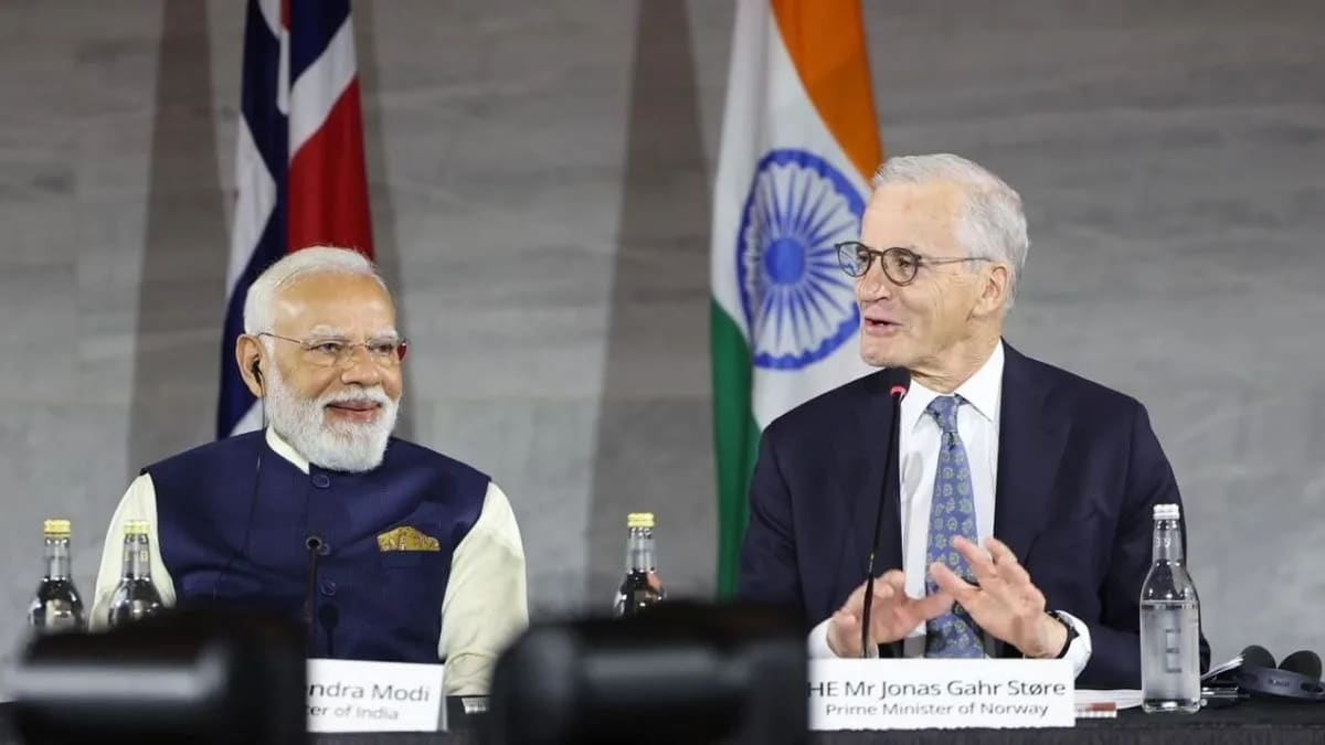 Indian and Norwegian officials shaking hands at signing ceremony for clean energy research agreements