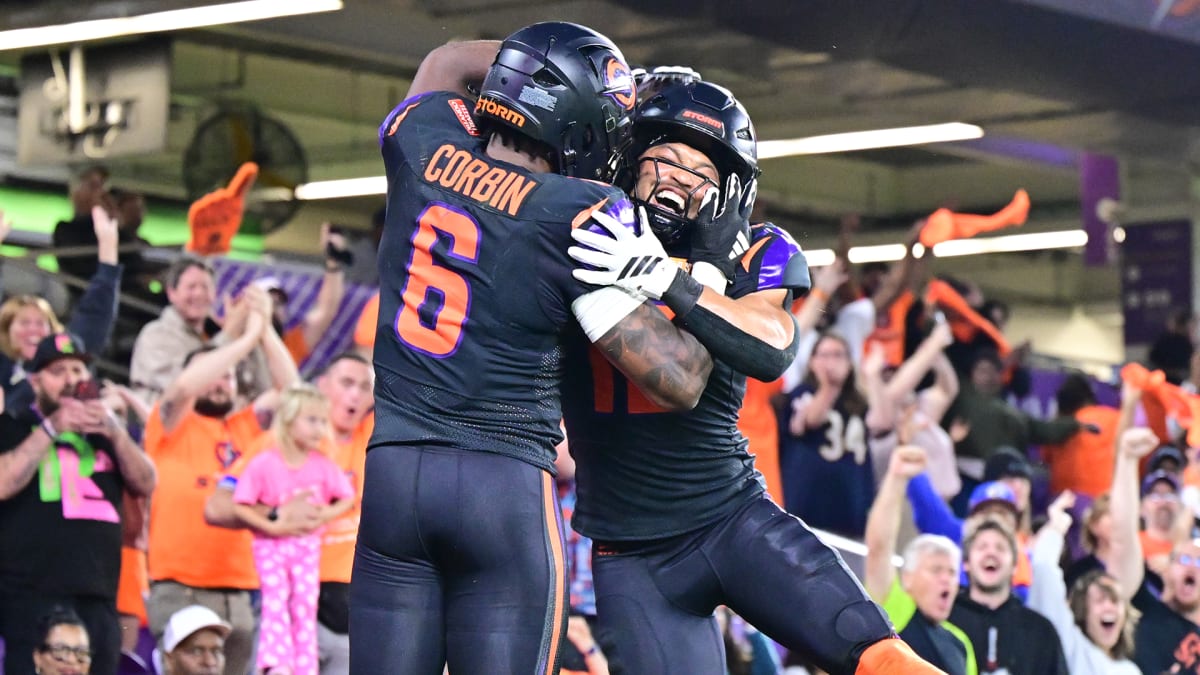 Orlando Storm quarterback Jack Plummer celebrating first franchise victory with teammates on field