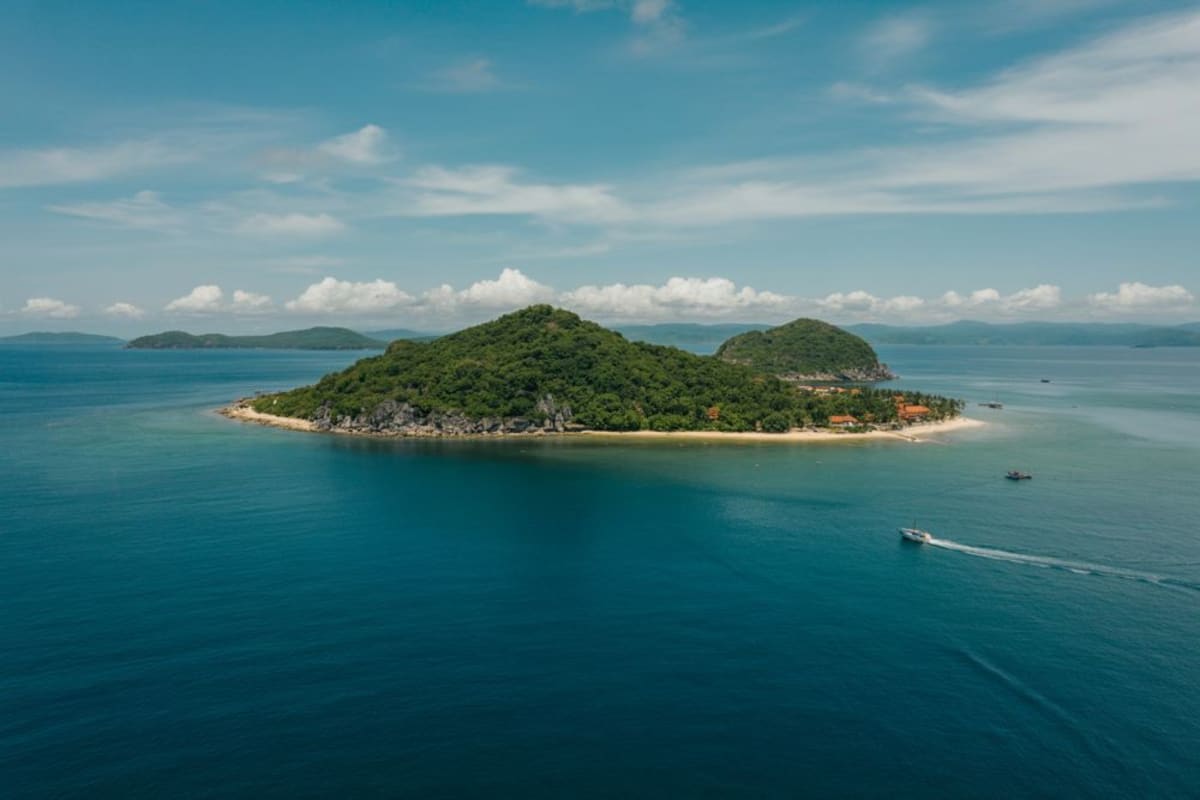 ** Pristine white sand beach with crystal blue water on Vietnam's Phu Quoc Island