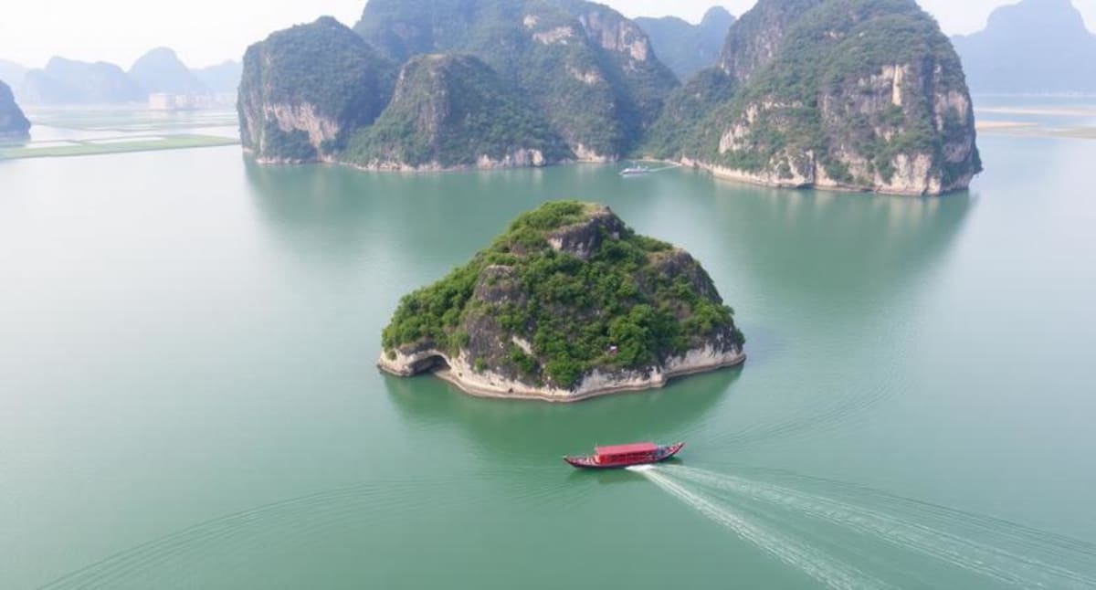 Tourists exploring vibrant Vietnamese street market with colorful lanterns and cultural attractions