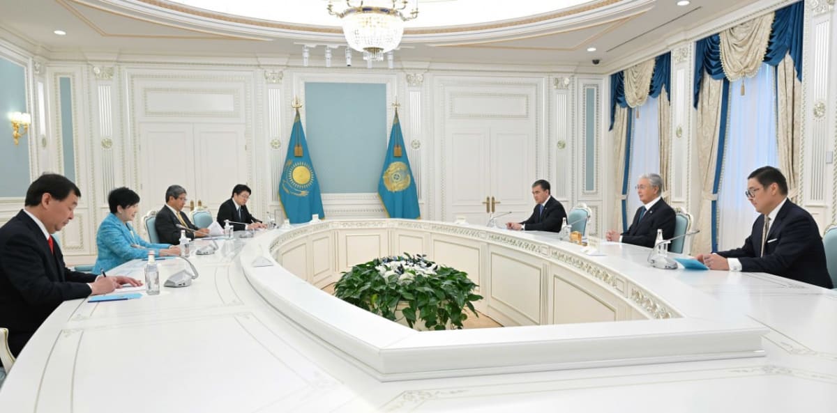 Kazakhstan President and Tokyo Governor shaking hands during diplomatic meeting in Astana