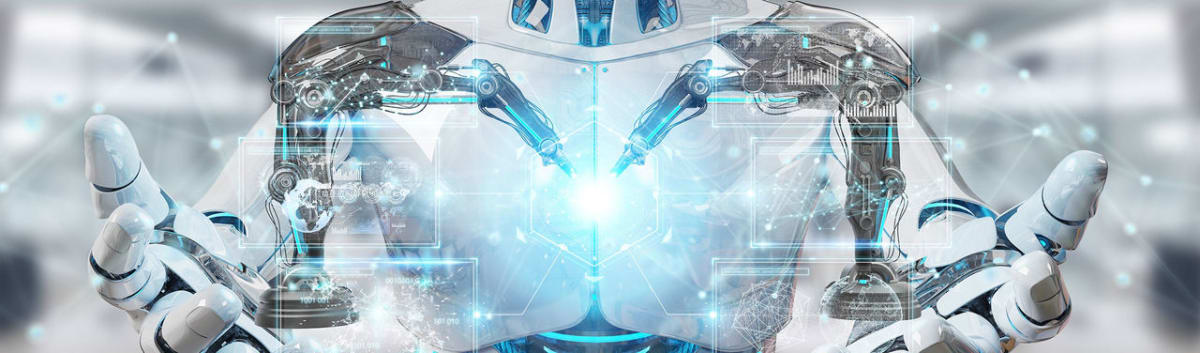 Robotic arm with sensors pausing mid-motion inside University of Cincinnati Innovation Hub workspace