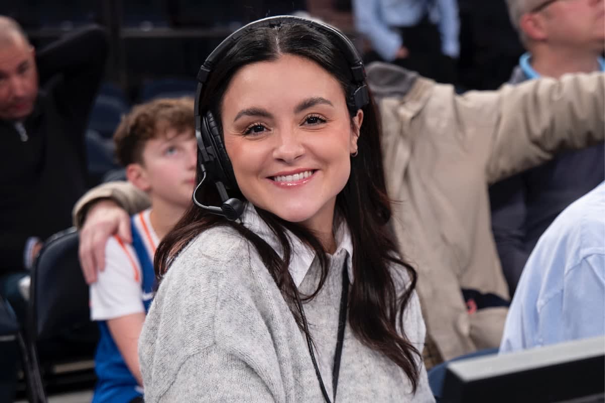 ** Olivia White stands before New York Knicks 2026 NBA Champions projection at Madison Square Garden
