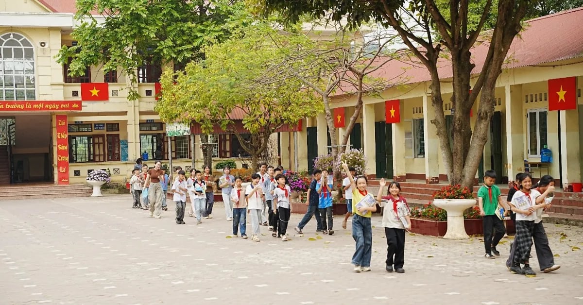 Vietnamese students returning to restored classroom with new furniture and learning materials after typhoon damage