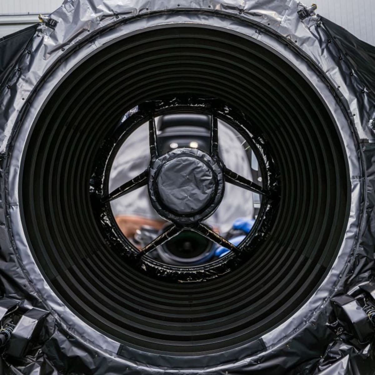 Large circular infrared mirror of NASA's Nancy Grace Roman Space Telescope in clean room
