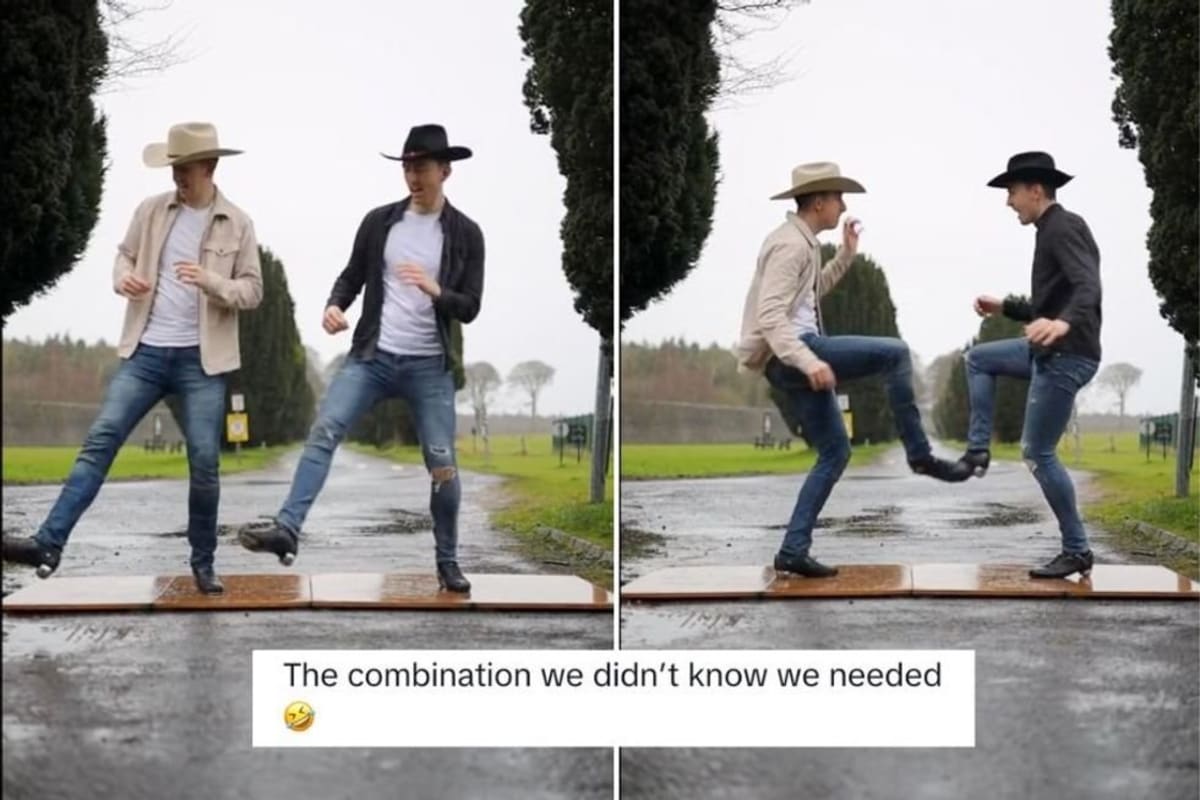 Two Irish step dancers in cowboy hats performing synchronized footwork outdoors in rain
