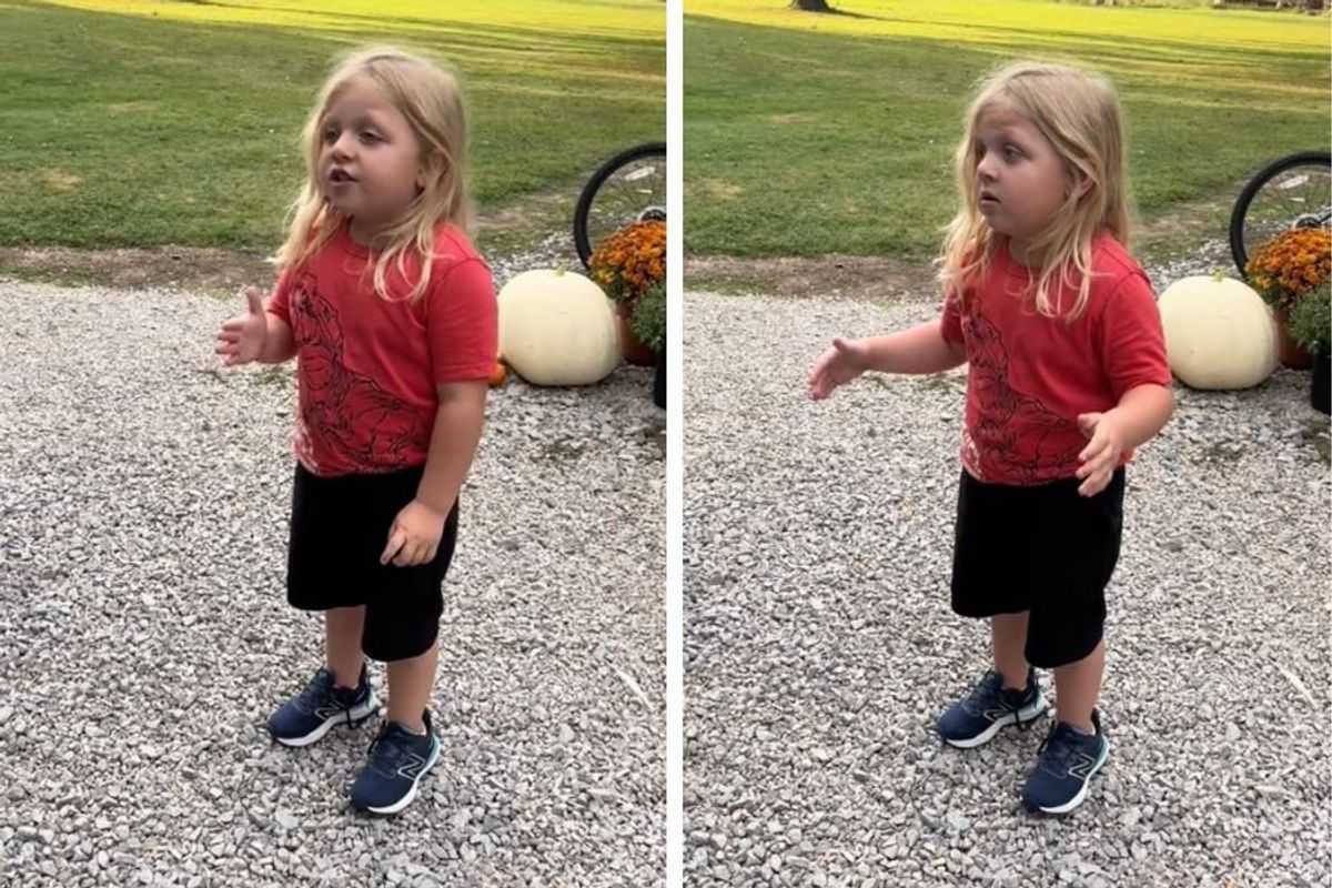 Four-year-old boy with long blond hair speaking seriously to camera about being tired