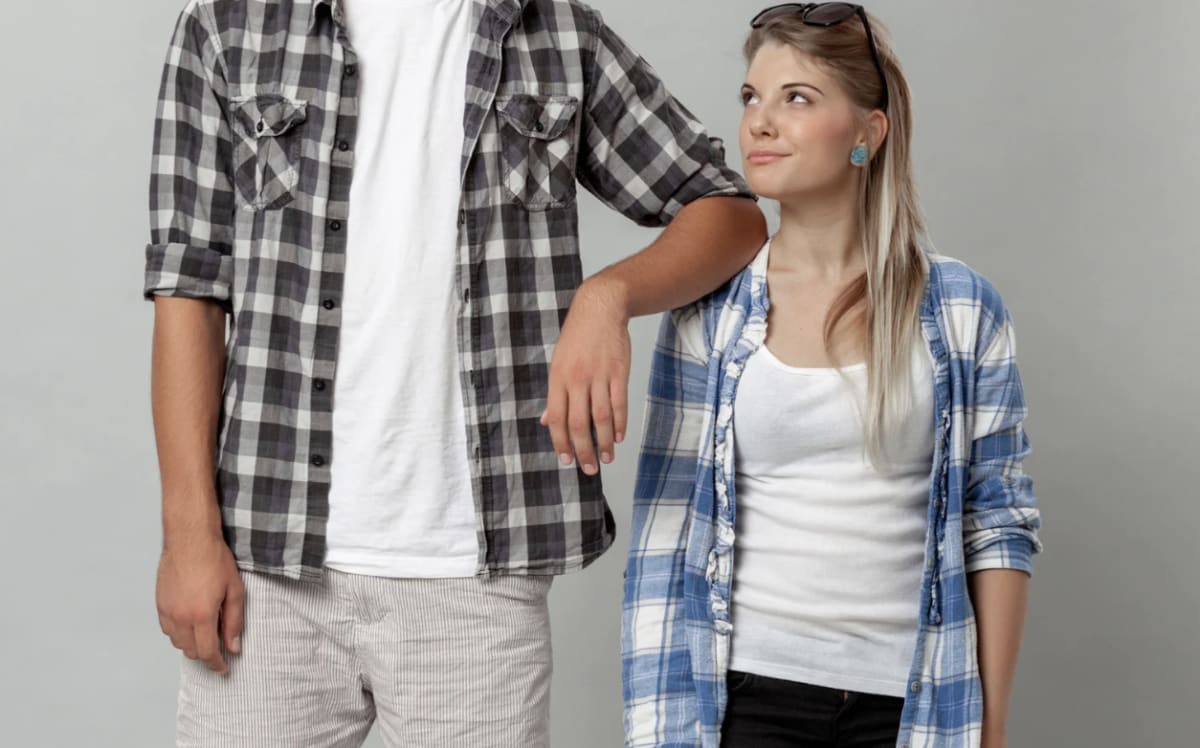 Very tall man cramped in airplane seat before kind stranger offers seat swap