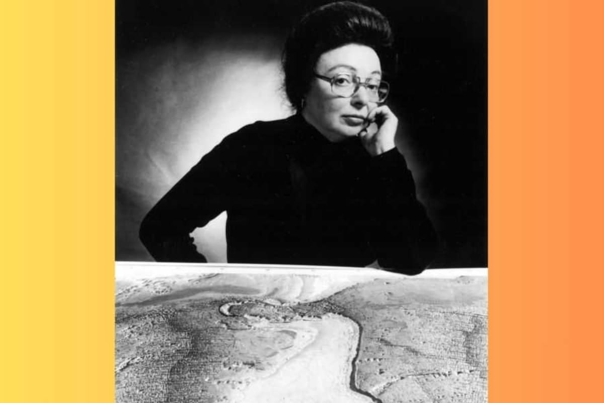 Marie Tharp examining hand-drawn oceanographic maps showing underwater mountain ranges and valleys