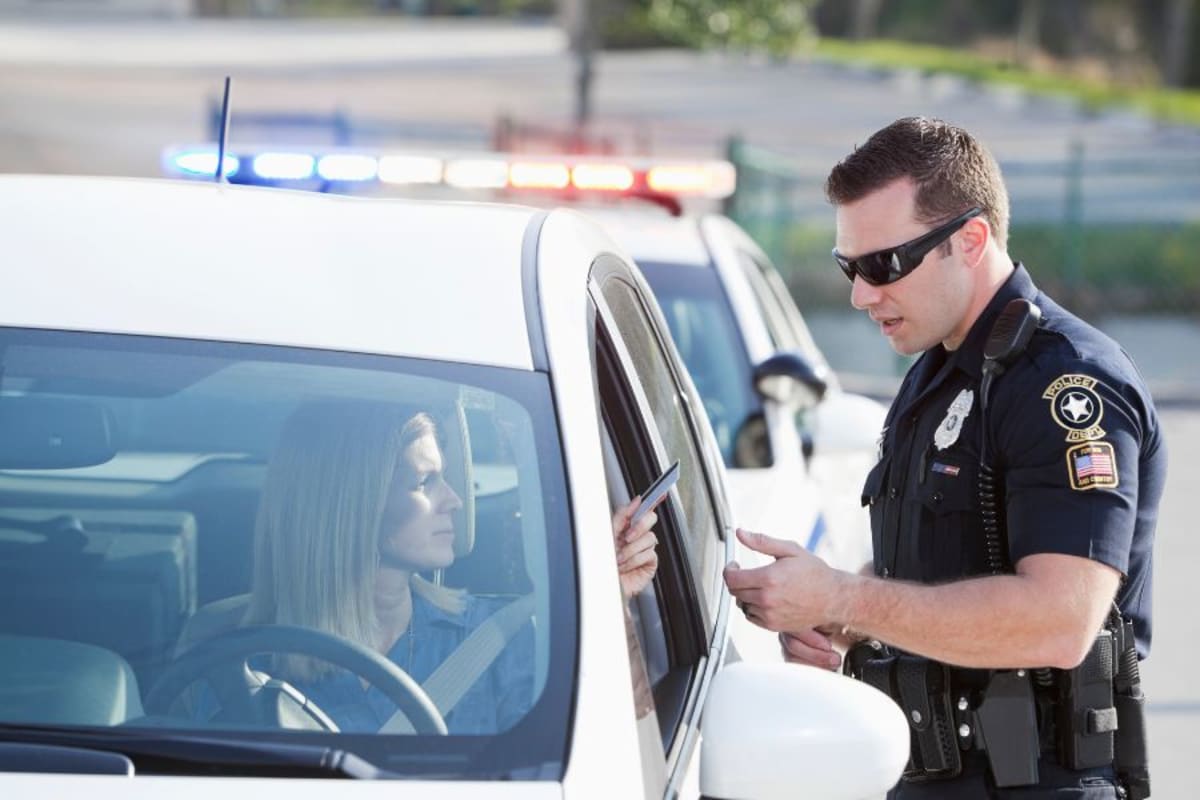 Officer Tickets Woman for Holding Phone in Missing Hand - Image 3