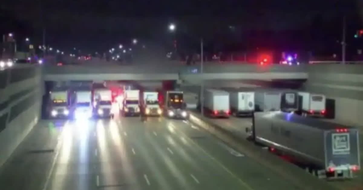 13 Truckers Line Up to Save Man on Michigan Bridge