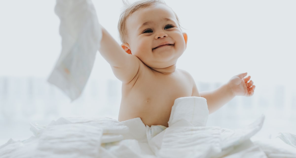 ** Stack of clean white diapers ready for newborn baby care and changing