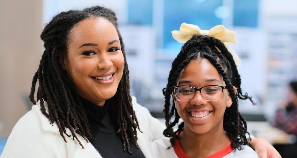 Big Sister Jaleesa and Little Sister Jaime smiling together at Big Brothers Big Sisters event