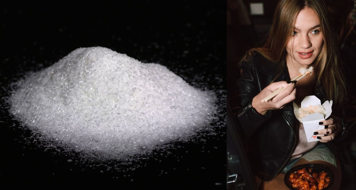Close-up of white crystalline monosodium glutamate grains on a surface